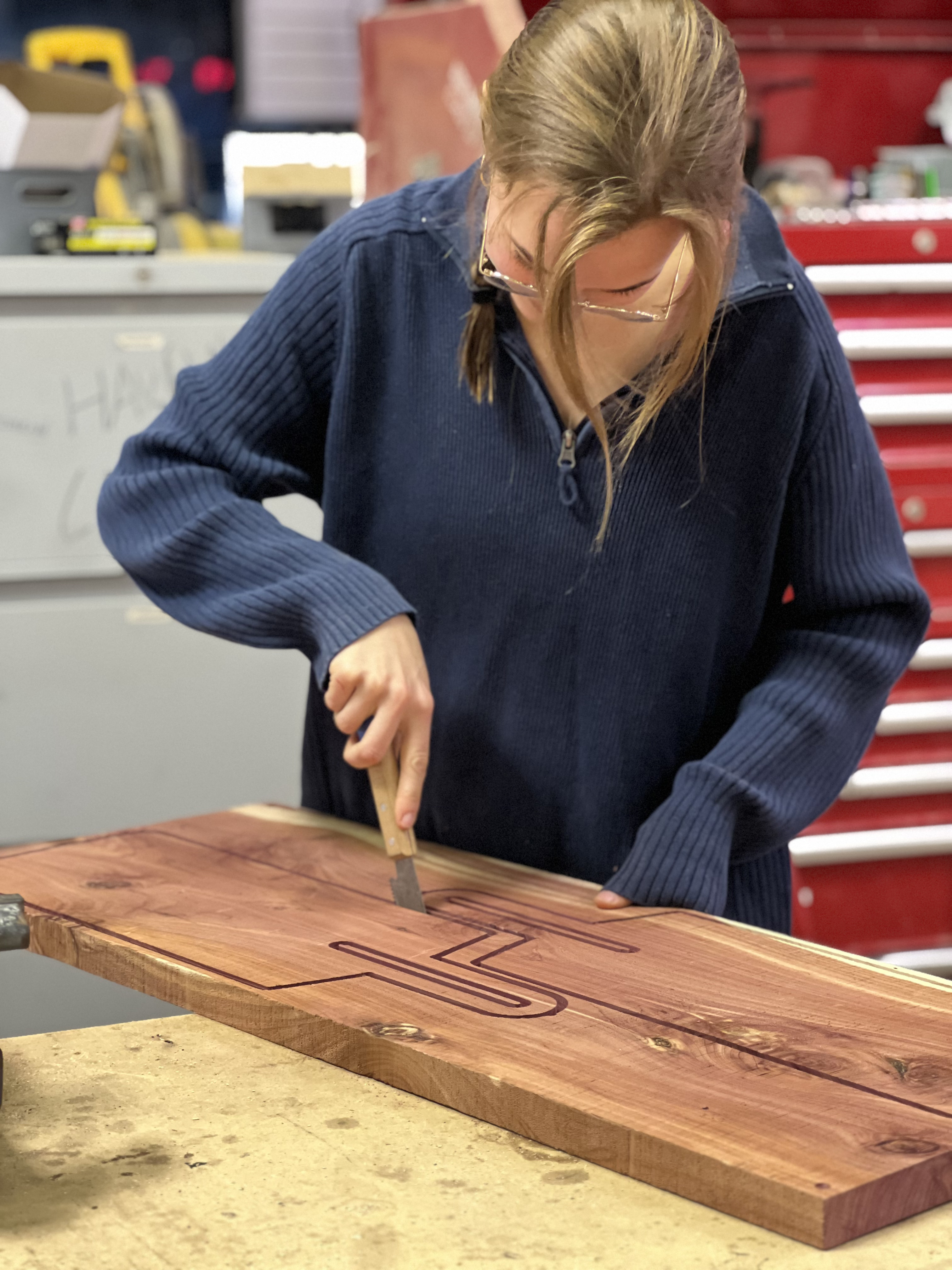 Craftsperson working on a wooden cutting board