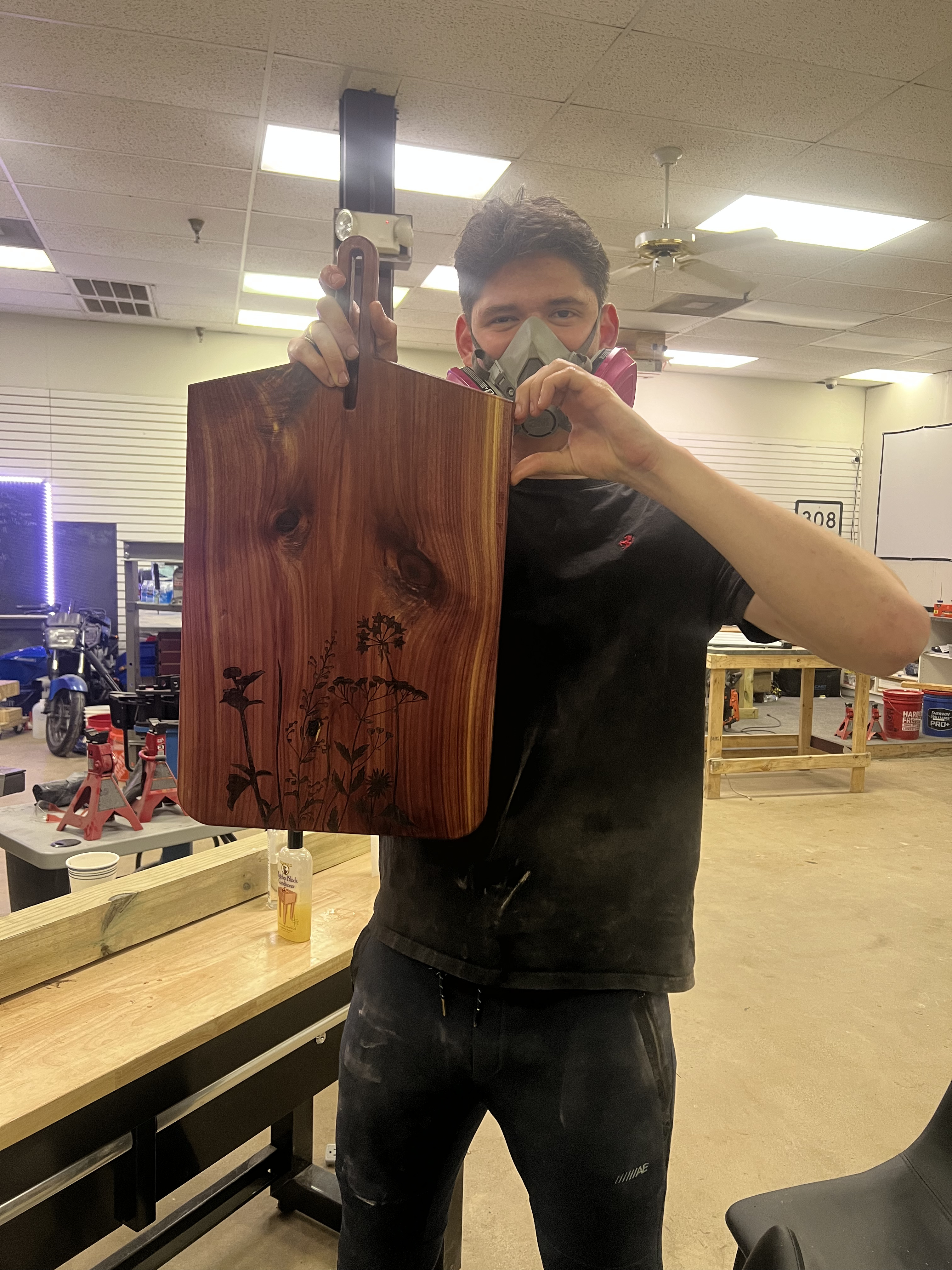 Finished cedar cutting board with beautiful floral engraving